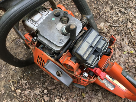 Chainsaw with top cover off
